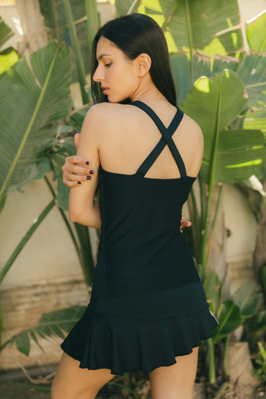 Mujer con camiseta de padel color negro - Trasero